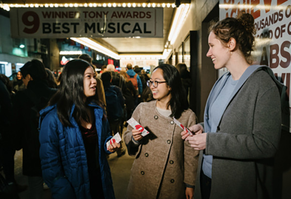 group of women gathered at an arts event